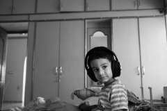 With-dad_s-headphones-listening-to-music